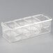 A clear plastic container with four compartments.