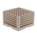 A beige plastic Vollrath Traex glass rack with many small compartments.