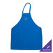 A blue Chef Revival bib apron with a logo on it on a kitchen counter.