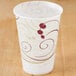 A Solo wax treated paper cold cup with a swirl design on it.