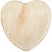 A close-up of a textured Eco-gecko palm leaf heart-shaped plate.