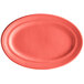 A red Tuxton oval china platter with a white background.