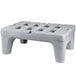 A grey plastic Metro bow tie dunnage rack with holes.