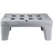 a grey plastic bench with holes