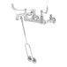 A T&S chrome wall mount service sink faucet with wrist action handles.