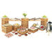 A bamboo rectangular riser shelf on a table full of food.