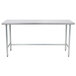 An Advance Tabco stainless steel work table with an open metal base.