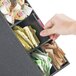 A hand using a Cal-Mil Classic Black Stir Stick and Condiment Display to get coffee condiments.
