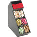 A black Cal-Mil condiment display with removable dividers holding various condiments.