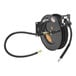 a black hose reel with a black hose attached