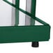 A close-up of a green metal Hatco buffet warmer shelf with glass top.