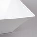 A close up of a white square Tablecraft melamine bowl