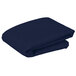 a folded blue blanket on a white background