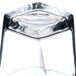 A close up of an Arcoroc Prysm Rocks Glass on a table in a bar.