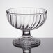 A clear glass bowl with a curved edge.