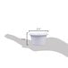 A hand holding a white Carlisle ramekin.