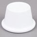 A white Carlisle melamine ramekin on a gray surface.
