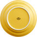 A yellow Tuxton Concentrix china plate with a white rim.