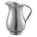 A Tablecraft stainless steel pitcher with a handle.