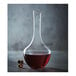 A Chef & Sommelier glass decanter filled with red liquid.