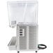 A Crathco stainless steel refrigerated beverage dispenser with clear plastic bowls and a clear cover.