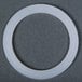 A white plastic circle for a Hamilton Beach blender cutter blade gasket.