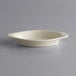 a white dish on a gray background