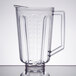 A clear plastic Hamilton Beach blender container with handle.