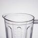 A clear plastic Hamilton Beach blender jar with a handle and measurements.