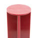 A red cylindrical pusher with a circular top for a Robot Coupe commercial food processor.