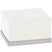A white rectangular riser with a stainless steel base.