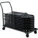 A National Public Seating folding chair dolly with black folding chairs stacked on it.
