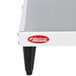 A white and black metal Hatco heated shelf on a table.