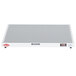 A white rectangular Hatco heated shelf warmer with a red label.