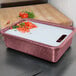 A Raspberry Prep n Serve Deep Tote with chopped tomatoes on a tray.