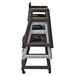 A Koala Kare stackable plastic high chair with casters.