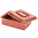 A red metal HS Inc. tamale server with a lid.