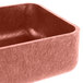 A large metal container with a lid in a copper color.