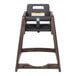 A brown high chair with a black seat.