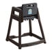 A brown plastic high chair with a black seat.