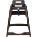 A brown Koala Kare stackable plastic high chair.