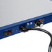 A navy blue and silver metal Hatco Glo-Ray heated shelf with a cord attached.