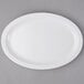 A white oval platter on a gray surface.