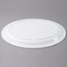 A white Thunder Group Nustone Melamine oval platter on a gray surface.