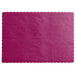 A wine colored paper placemat with scalloped edges.