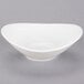 A Tuxton Pearl White China Bouillon bowl with a curved edge.