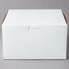 A white 7" x 7" x 4" cake box with a lid.