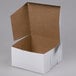 A white cake box with an open lid.