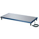 A navy blue rectangular Hatco heated shelf on a table with a black cord.