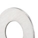 A close-up of a stainless steel Nemco flat washer.